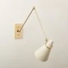 Aldus Ivory And Polished Brass Articulating Wall Sconce -Home Furnishing Store AldusIvNPldBrsArtlngScncSHF22