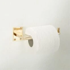 Kela Unlacquered Brass Wall Mounted Toilet Paper Holder -Home Furnishing Store KelaWallMntdTPHldrPldBrsROF22